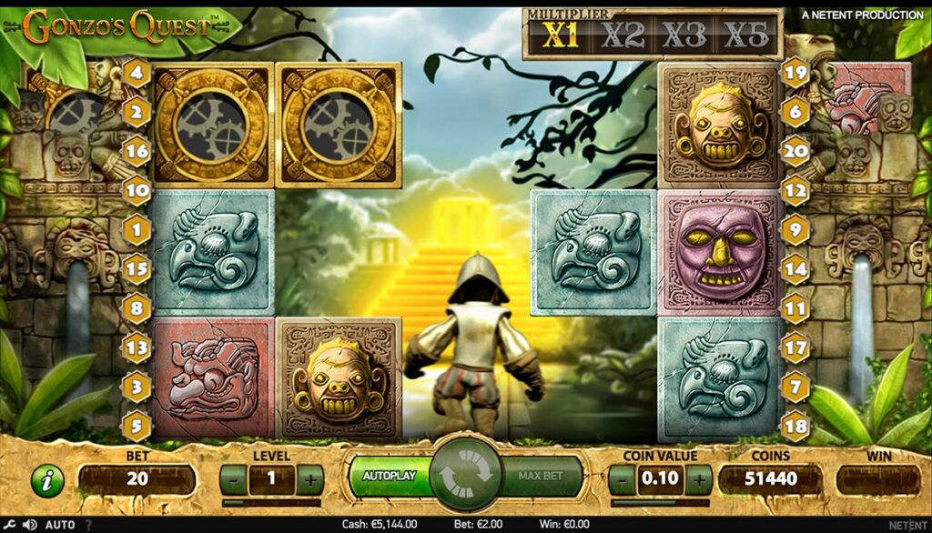 Three golden Free Fall scatter symbols aligned on a payline, activating the bonus round in Gonzo's Quest.