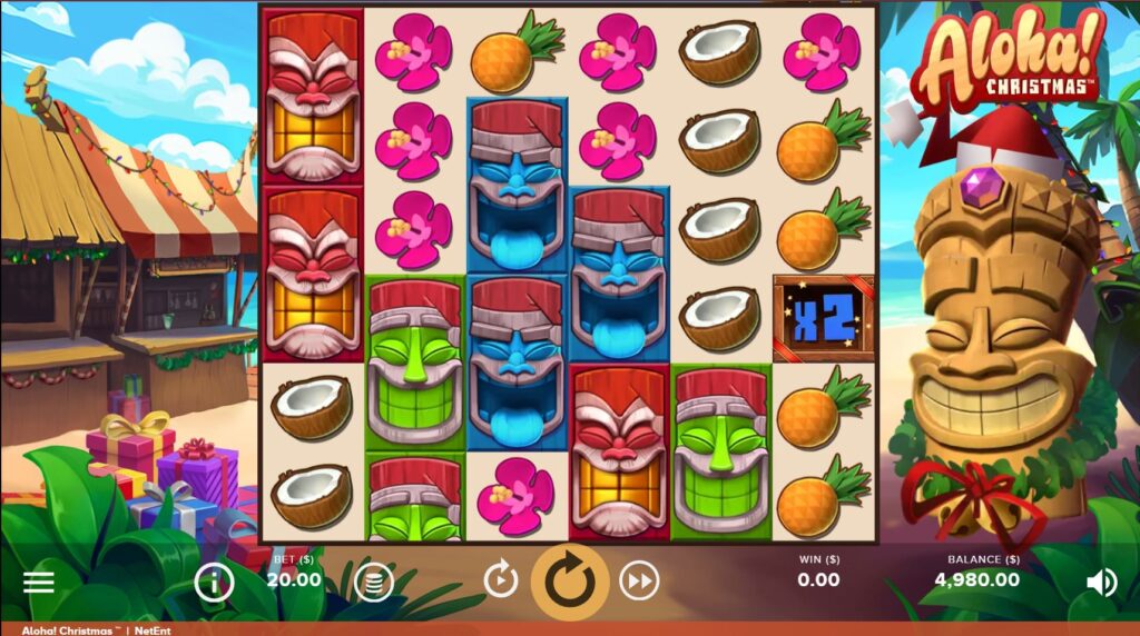 Aloha! Christmas slot main game screen with the 6x6 grid and Tiki character.