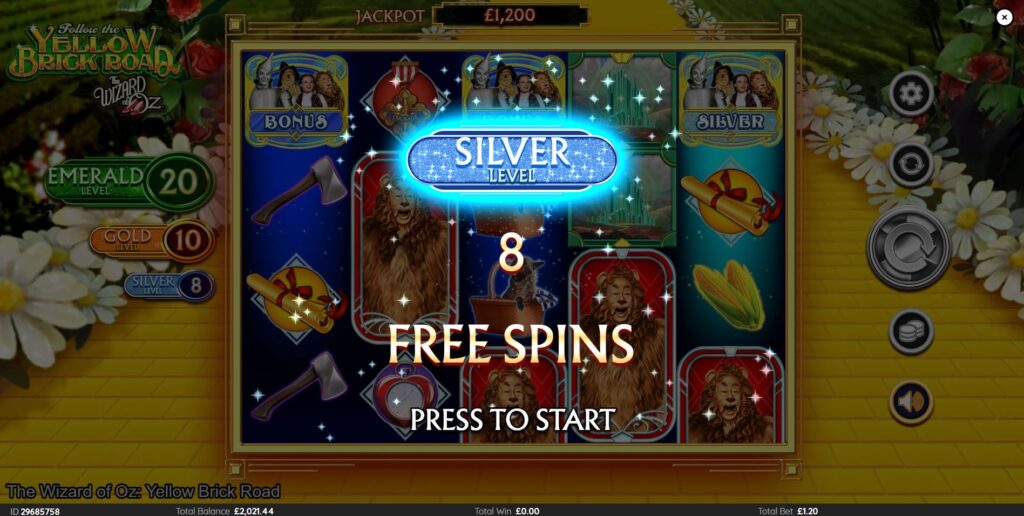 The triggering symbols for the Yellow Brick Road Bonus landing on the reels.