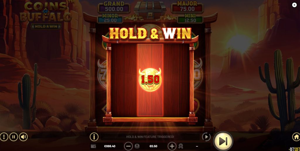 The moment the Hold & Win feature is triggered in Coins of Buffalo with three golden bonus symbols.