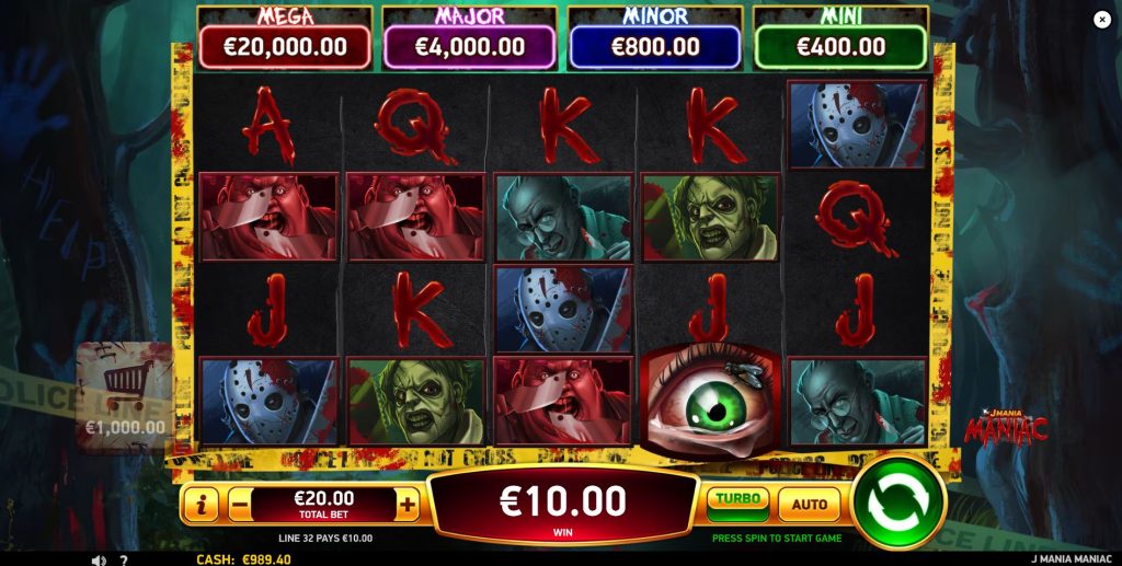 The 5x4 reel layout of the J Mania Maniac slot during standard gameplay, showing various horror character symbols.