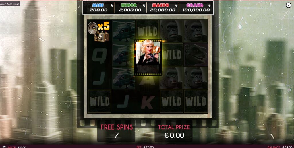 The Photographer symbol collecting multiplier prizes during the Free Spins round of Kong Rising.